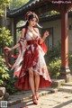 A woman in a red and white dress is posing for a picture.