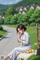 A woman sitting on a bench talking on a cell phone.